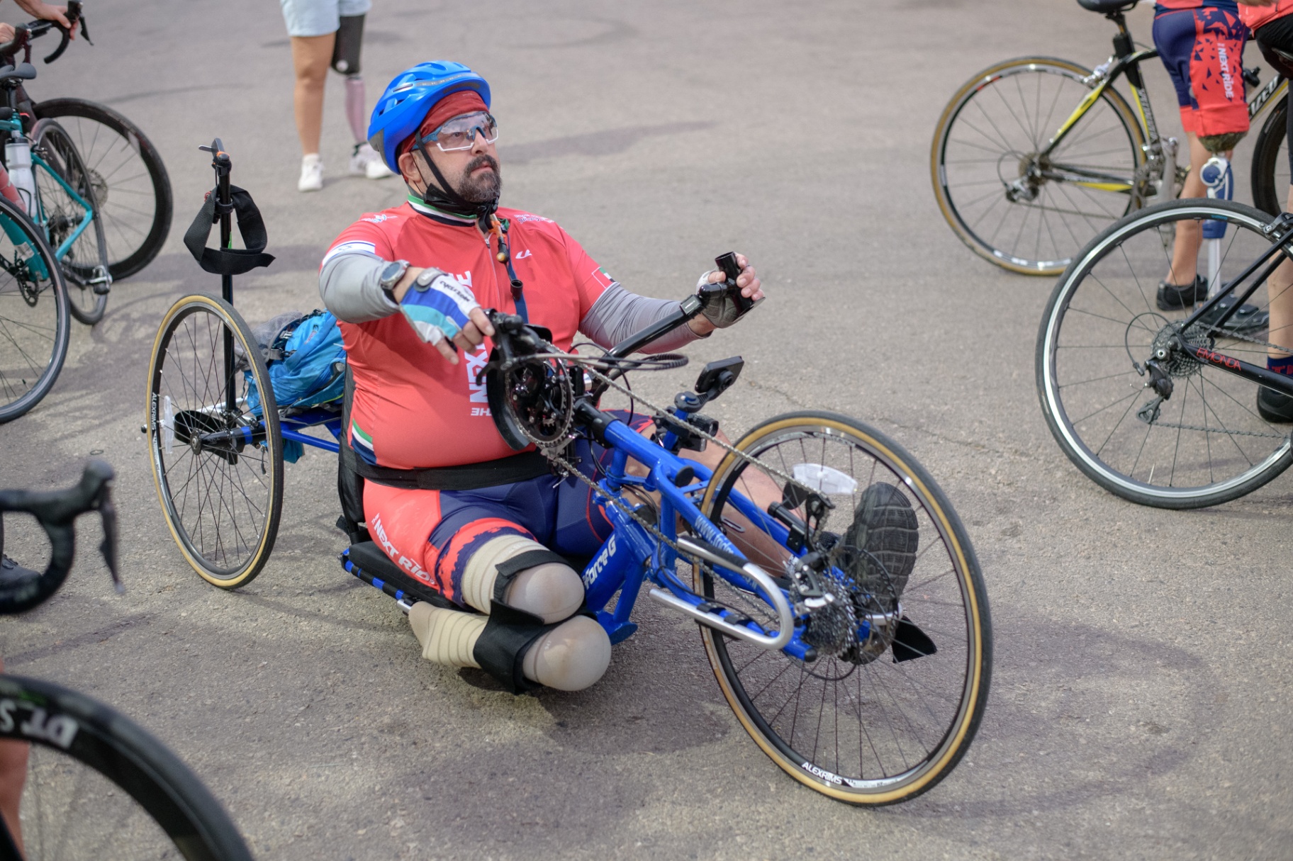 Amputee handcyclist preparing to ride with the team