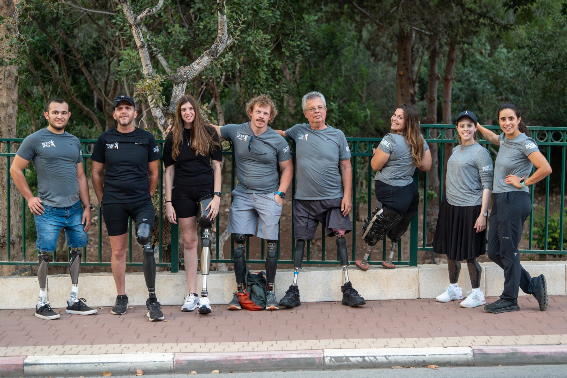 The Next Step community of amputees standing together